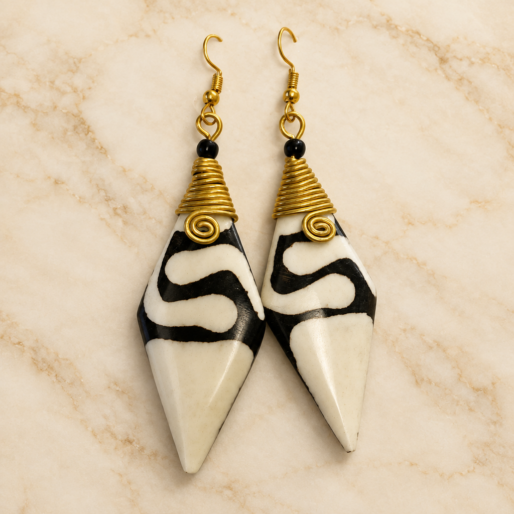 Black and Ivory Pointed Drop Earrings with cream marble background