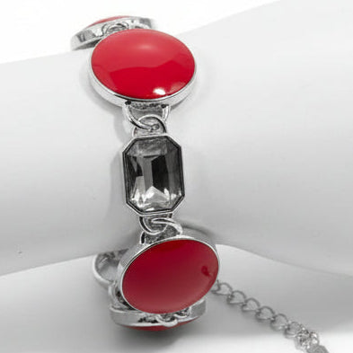 Bracelet with red circular beads and silver chain