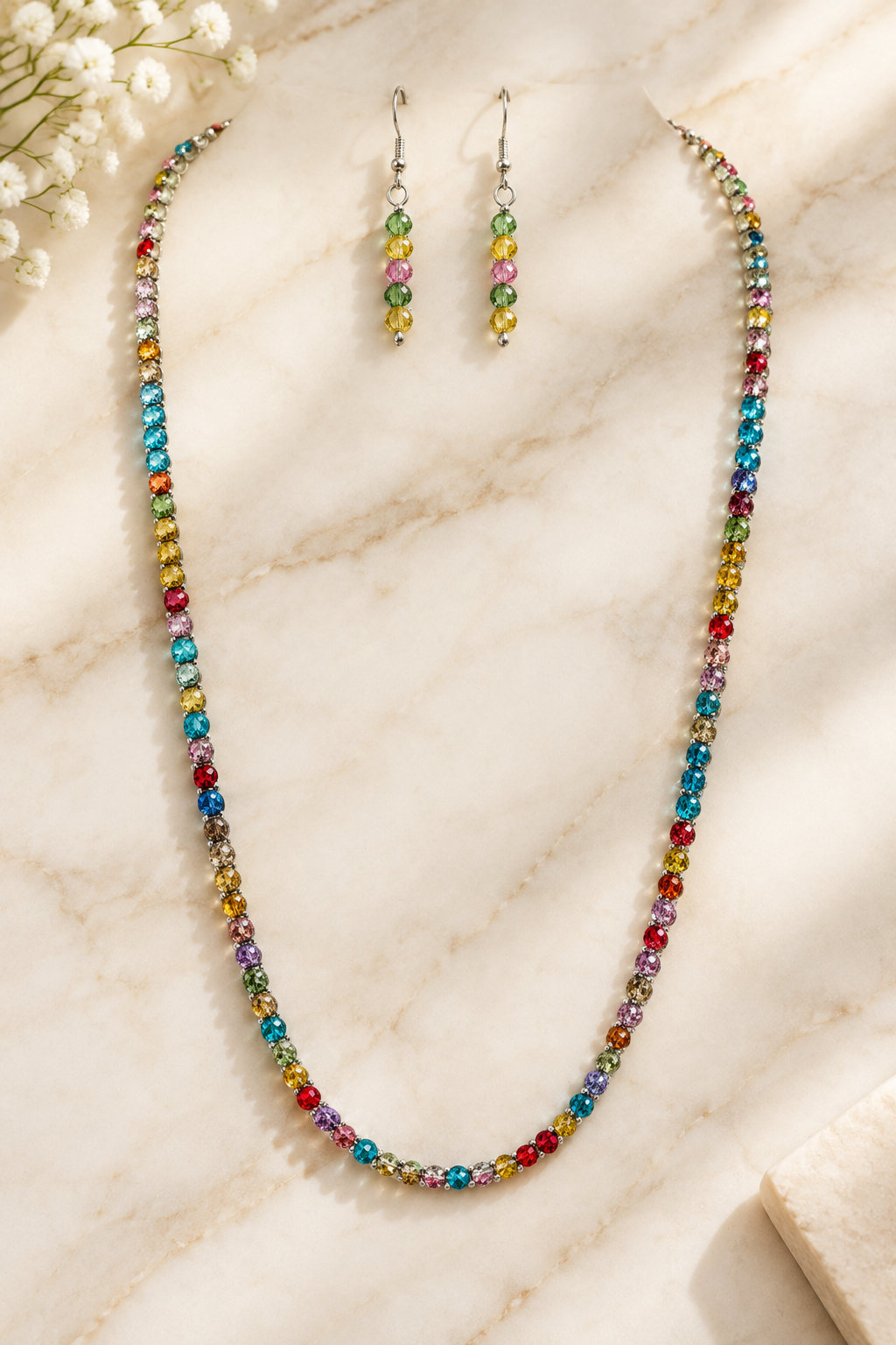 Multicolor Rhinestone Necklace & Earrings on cream marble