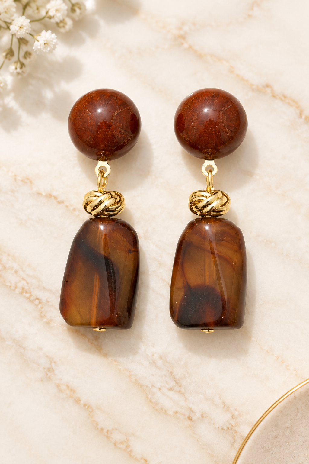 Brown Acrylic Earrings on cream marble