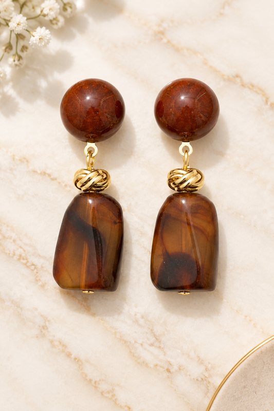 Brown Acrylic Earrings on cream marble