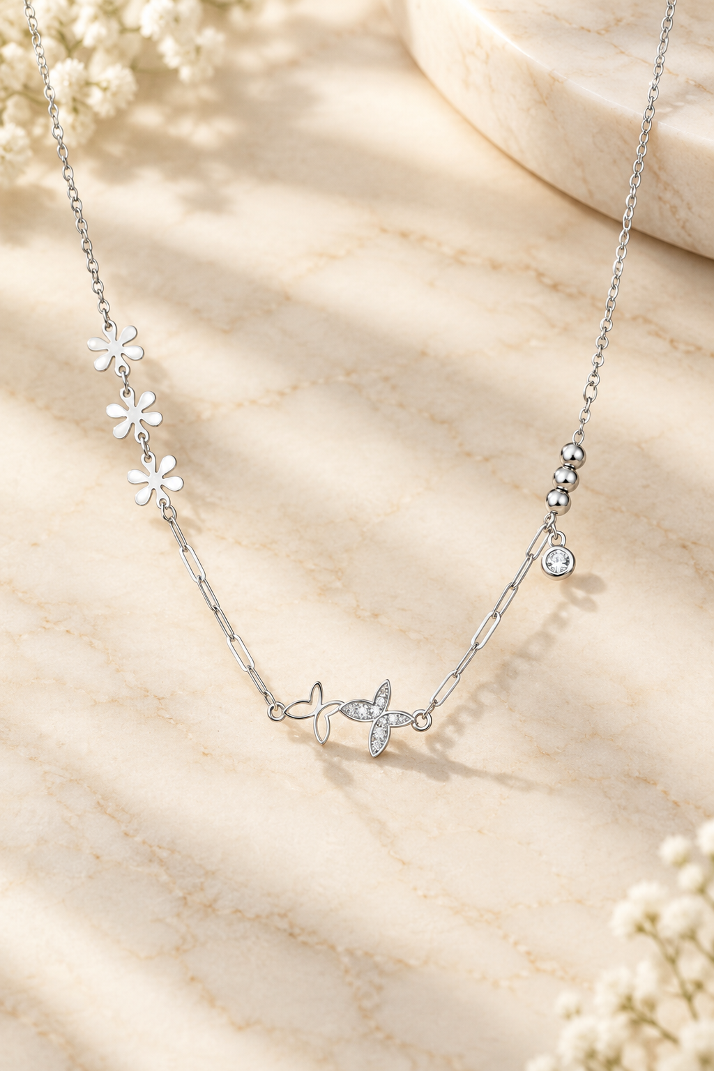 Crystal Wings Anklet on cream marble