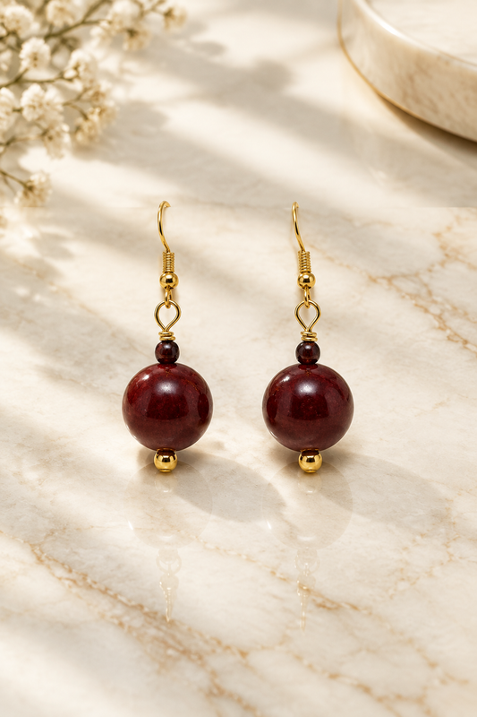 Deep Red Earrings on cream marble