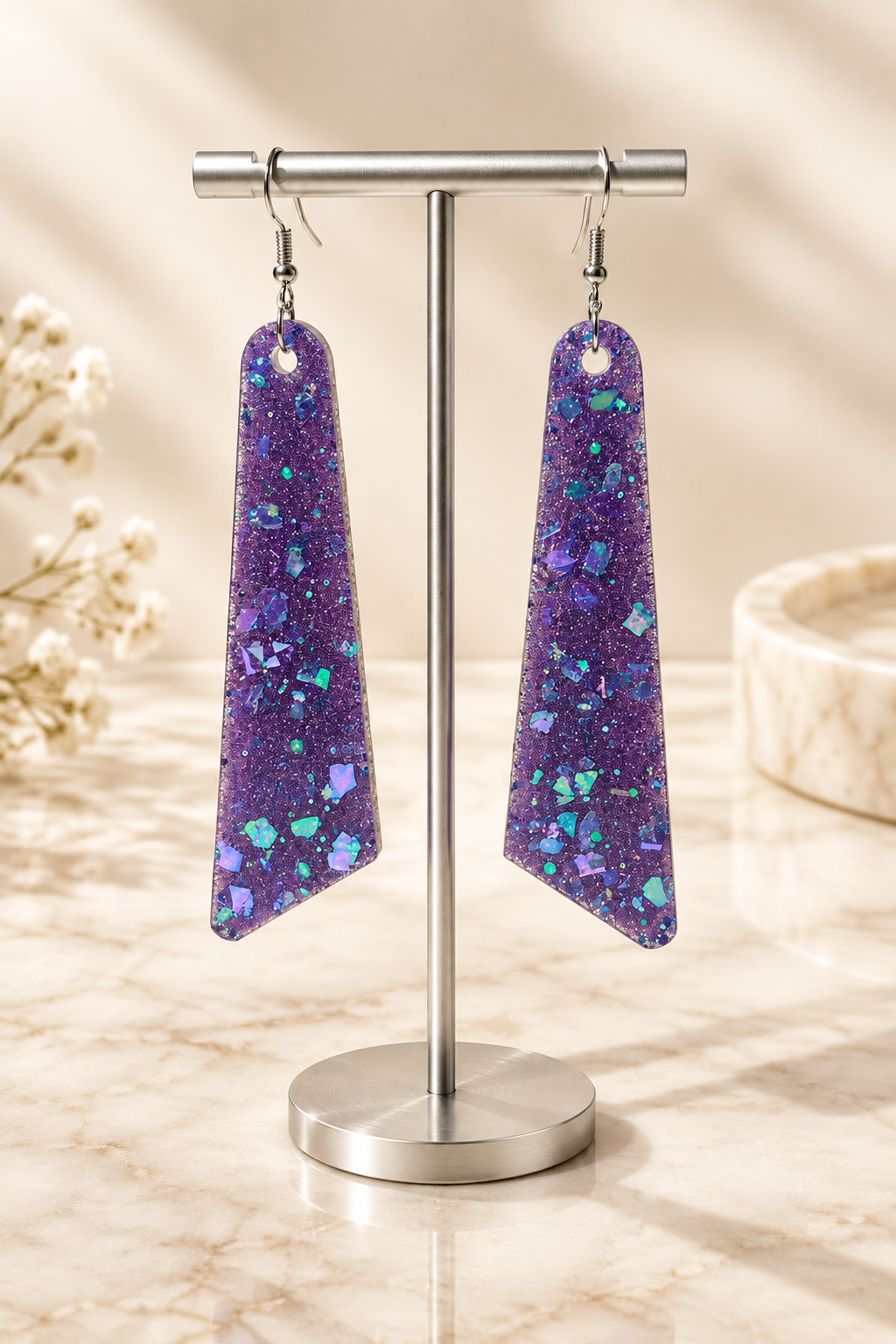 Midnight Glow Long Drop Earrings on cream marble