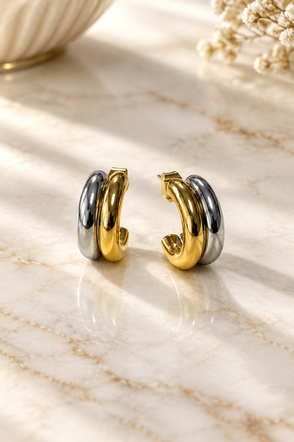 Mixed Metal Hoops on cream marble