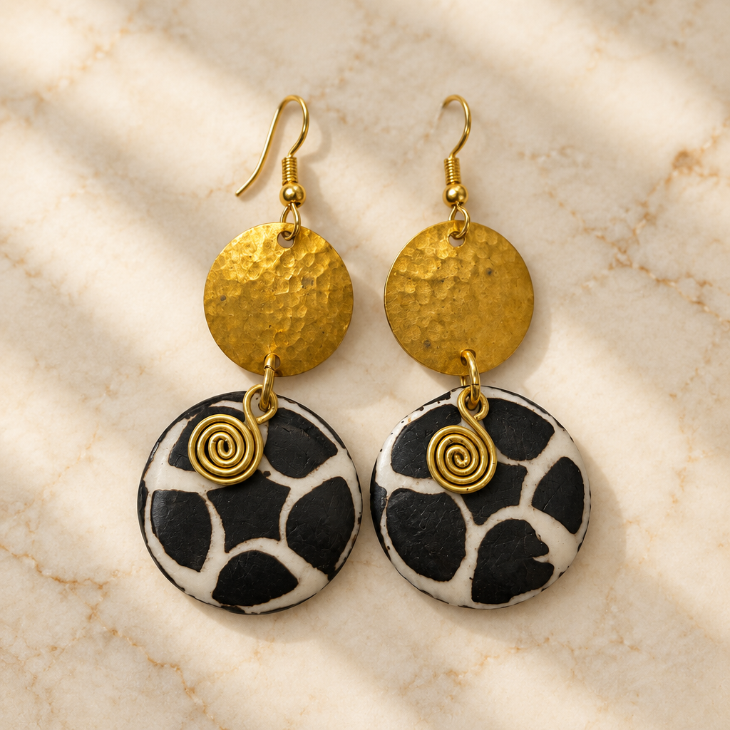 Rounded Patterned Hammered Earrings on cream marble