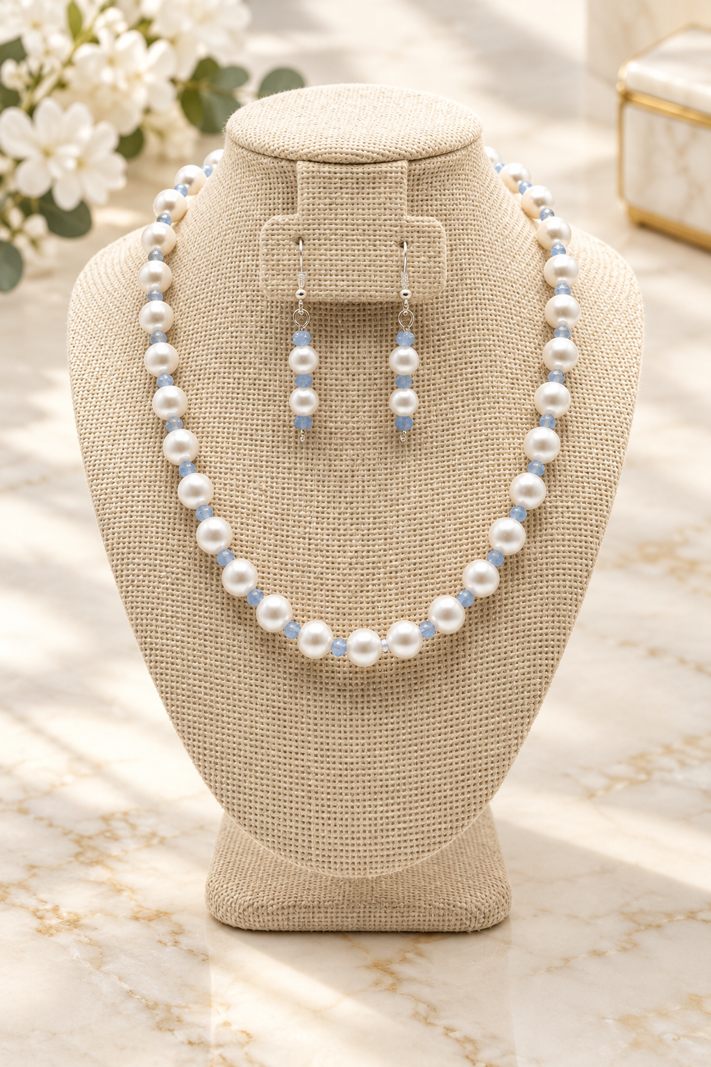 Serene Pearl & Sky Blue Beaded Necklace Set on cream marble