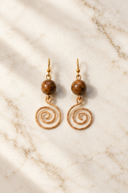 Tiger Eye Heritage Spiral Earrings on cream marble