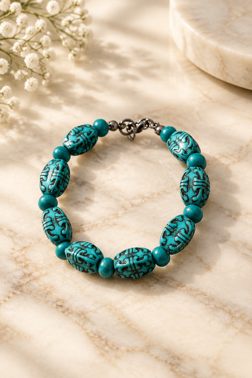 Turquoise Ancestry Bracelet on cream marble